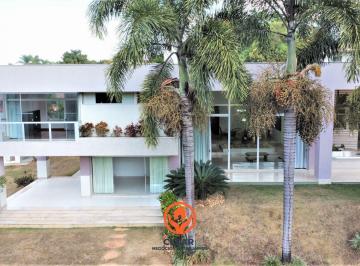 Fachada frontal da Casa 608m² no Bairro Braúnas BH, terreno 3.070m², paisagismo com palmeiras e arquitetura moderna em dois pavimentos. · Casa 608m² / 4 Quartos / 10 Vagas / Terreno 3.070m² / Área Verde / Bairro Braúnas BH