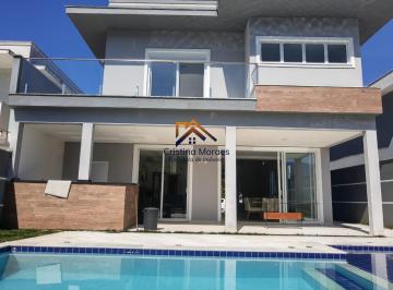 Foto 01 · Casa com fachada linda e moderna no condomínio Morada da Praia