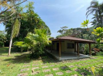 Imagem do Imóvel · Casa em condomínio frente à praia da Enseada.