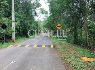 Frente do lote, rua asfaltado, câmara de segurança. portaria e segurança 24 horas. · Condomínio Arvoredo