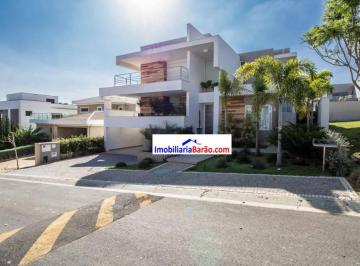 f302300be50a720927c3a605d275e1c9590af054 · Excelente sobrado no residencial Mont Blanc com um projeto Paisagístico único com 510m² em um terren