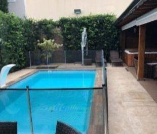98e07e8b9c12eed444d308a55d66ce1b3249a8ca · Casa com 4 dormitórios à venda, 370 m² por R$ 1.800.000,00 - Condomínio Residencial Terras do Caribe