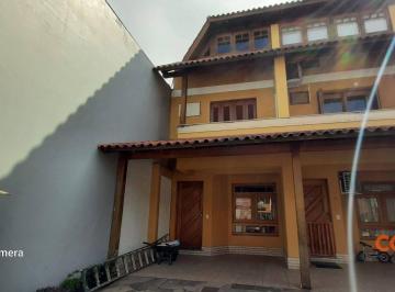 ee4cf95bcdf4e612575a37904e0286d682487ee6 · Casa com 3 dormitórios para alugar, 110 m² por R$ 3.428,00/mês - Cavalhada - Porto Alegre/RS