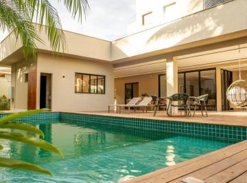 Foto 1 · Sobrado com excelente acabamento no Residencial Goiás do Alphaville Flamboyant em Goiânia. Possui 05