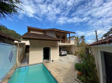 8de5ede67501faf1420110c6a5bcbead9e6e3557 · Casa com 4 dormitórios à venda, 300 m² por R$ 1.400.000,00 - Pitangueiras - Guarujá/SP