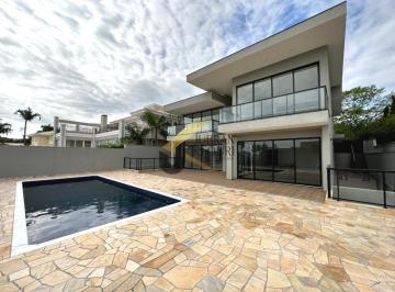 Foto 01 · Casa à venda no Alphaville Campinas, com 4 suítes, lazer comum e garagem para vários carros.