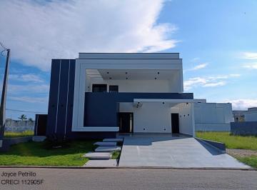Foto 01 · Casa Nova com Arquitetura Moderna à Venda em Condomínio Fechado na Cidade de Peruíbe.