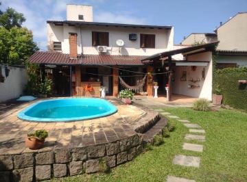 Casa · 236m² · 3 Quartos · 3 Vagas · Casa com 3 dormitórios à venda, 235 m²- Guarujá - Porto Alegre/RS