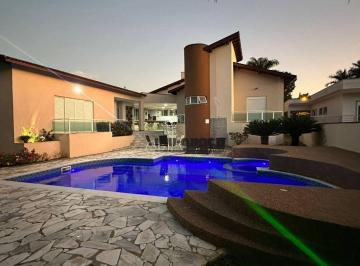 b29357b0a504c4bfe397fb9e26e380df563b279f · Casa com 5 dormitórios à venda, 452 m² por R$ 2.690.000 - Condomínio Portal Bandeirantes - Porto Fel