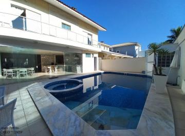 Foto 01 · Casa com 4 suítes a 100 m da praia em condomínio de Luxo em Peruíbe.