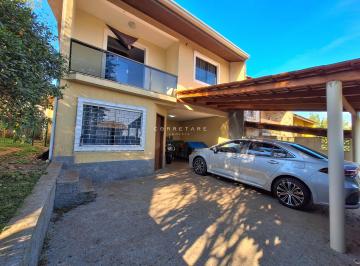 garagem do sobrado · Sobrado de esquina com 3 quartos, terreno com pomar no Bairro Santa Cândida