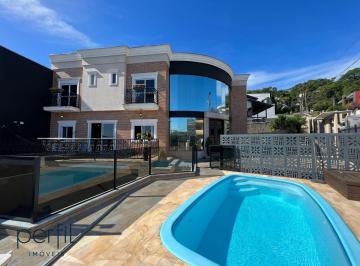 Foto 01 · Sobrado de esquina a venda com quatro suites e piscina no bairro Bom Retiro - Joinville/ SC