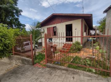 Terreno · 200m² · Casa de madeira com terreno medindo 200 m² no Bairro Dores.