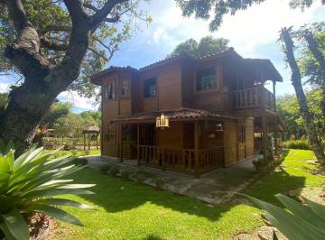 Foto 01 · Sítio à Venda em Esmeraldas - 6.000m², Casa de Madeira, Área Gourmet, Orquidário e Muito Mais! Apena