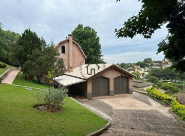 Fachada casa lateral · Casa à venda no condomínio Marambaia em Vinhedo.