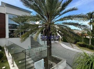42fb7aecdbdd270a1a288d27f7201453a3f4f9e6 · Casa térrea em frente ao lago, com 5 suítes no Cond. Marambaia.
