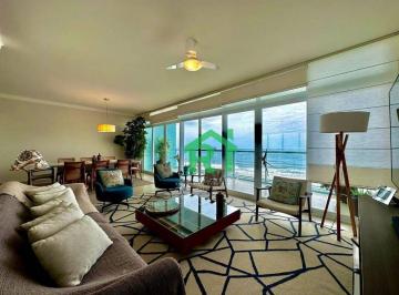 Sala · Apartamento frente mar com 4 quartos (3 suítes), 1 vaga à venda em Pitangueiras, Guarujá