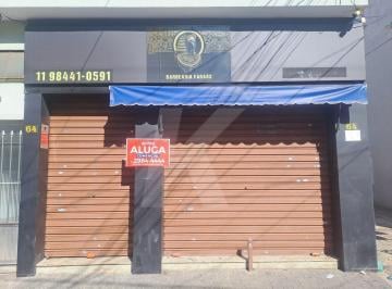 Comercial · 40m² · Salão comercial com banheiro e porta de aço.