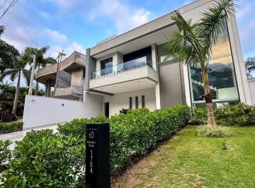 Casa · 450m² · 5 Quartos · 4 Vagas · Descubra o seu refúgio exclusivo no  Jardim Acapulco com esta deslumbrante residência a venda.