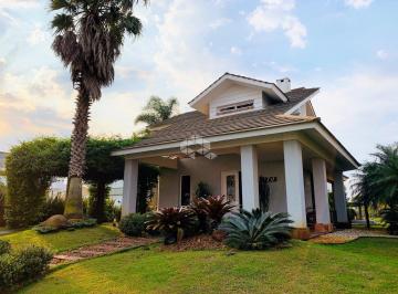 Apartamento · 246m² · 4 Quartos · 2 Vagas · Sobrado 4 suítes, sendo 1 térrea, amplo terreno frente lago, garagem para 2 carros  no condomínio fe