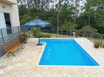 Foto 01 · Casa térrea a venda com 4 Suítes em Condomínio - Piscina com aquecimento