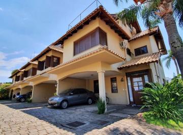468200_iEyWr7_46820065ef10601f904.jpg · Casa em Condomínio à venda no bairro Trsiteza com 03 quartos e 02 vagas