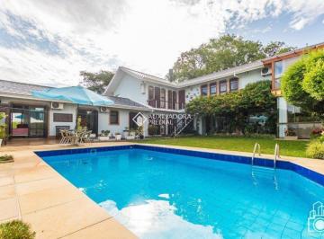 411926_izAP53e2_411926641f37b632d8b.jpg · Casa com 460m², 6 dormitórios e piscina no bairro Três Figueiras