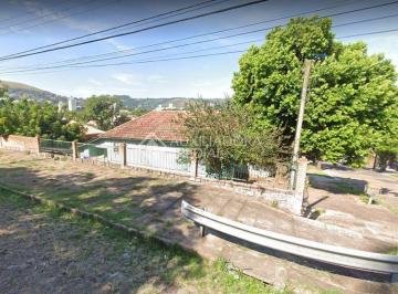 375149_iEa8B9A9KG8_375149629a5a4378490.jpg · Terreno de esquina com 242 m² de área total no Bairro Partenon em Porto Alegre