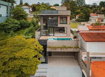 Casa à venda no condomínio São Paulo II- fachada primária · Casa à venda - na Granja Viana