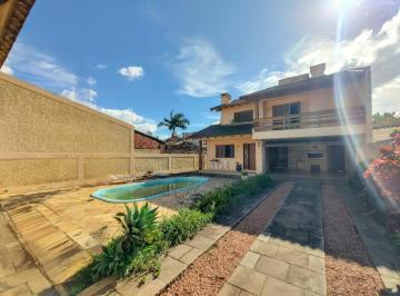 478452_iB776M44IT69pE894IrY_478452664b42457cdee.jpg · Casa com 4 dormitórios (1 suíte master) sala com lareira, piscina e terreno plano no Mauá em N.H