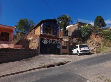 370885_iB513Ua5_3708856260498bb6690.jpg · Casa de dois dormitórios com garagem, terreno de 10 x 44, acima do nível da rua
