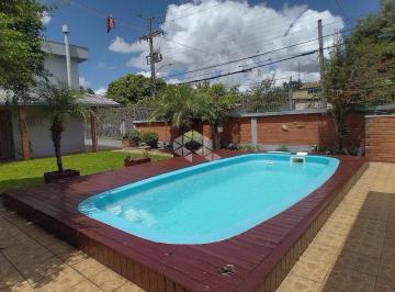 504596_i2IF3zbG96PB1764764_50459665d4ed0669848.jpg · Casa/Sobrado com 3 dormitórios, 2 Salas, sendo 1 com lareira, 3 banheiros, Piscina e Quiosque com Ch