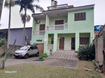 493672_i7A39_49367266d8859ab0c9a.jpg · Casa com 4 quartos e 2 suítes, vagas de garagem e churrasqueira