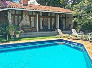 Vista da casa térrea , jardim e piscina · Linda casa térrea 4 suítes, piscina, 10 vagas, Tremembé