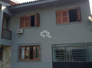 5 · Casa de 03 dormitórios no Bairro Neópolis em Gravataí.