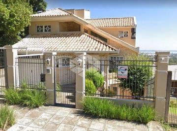 242867_i52tvY1_24286762dea6a06db4c.jpg · Casa sobrado no bairro Vila Nova, em Porto Alegre, com 3 dormitórios, suite e pátio com piscina