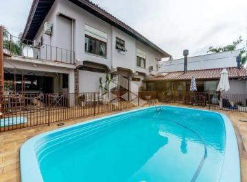 63212_iUd8BqWC146n427Vi5i2_6321267485c0d720d4.jpg · Casa com 3 quartos, 3 suítes e 4 vagas no bairro Jardim Lindóia em Porto Alegre-RS!