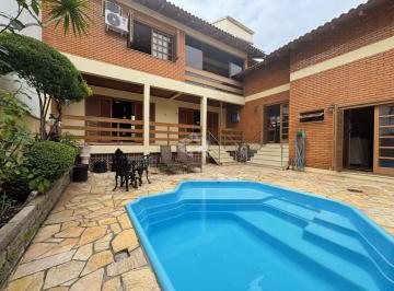 639239_iJusf4Xp1nU437CD2RQ_639239684d96f50a5fe.jpg · Casa 3 dormitórios, 3 suítes, pátio com piscina, no bairro Marechal Rondon, próxima ao parkshopping,