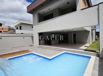 Foto 01 · Sobrado à venda em condomínio dentro da cidade, 4 suítes, piscina e fireplace