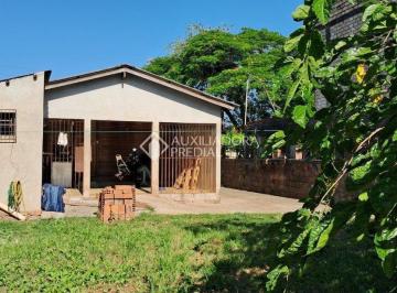 Fundos e parte de alvenaria · Terreno / casa de madeira na Scharlau