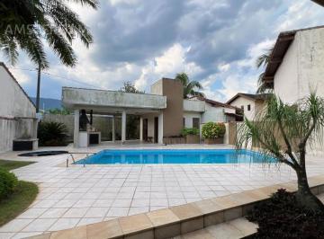 Piscina vista dos fundos · Bougainvillee - Sua casa no melhor condomínio de Bertioga