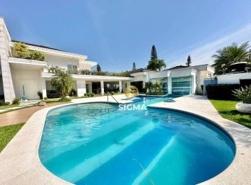 e61e3d12a5d7a4b966d83b005629a8f54d58bbd7 · Casa com 7 suítes à venda no Condomínio Jardim Acapulco - Guarujá/SP.