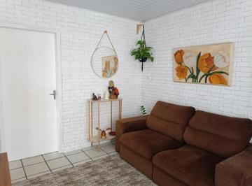 Foto da sala da casa térrea · 2 CASAS À VENDA, CADA CASA COM 3 DORMITÓRIOS E ENTRADA INDIVIDUAL NO CARIANOS - FLORIANÓPOLIS