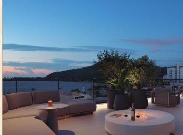 Terraço externo do lazer, com mesa de fogo e vista para o morro (imagem ilustrativa) · Apartamento à venda no Edifício Lotisa Sun Park Residence