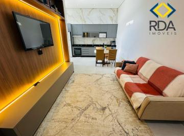 Foto 01 · Esta casa possui uma planta diferenciada em formato de L, integrando garagem e quintal para melhor a
