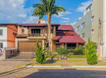 Casa · 384m² · 5 Quartos · 4 Vagas · Sobrado com 5 dormitórios, 4 banheiros, 1 lavabo, piscina no centro de Torres