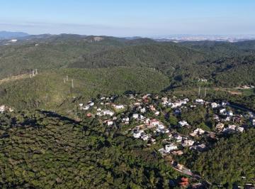 0 · Terreno plano com vista em condomínio fechado com 1043m² pronto para construir.