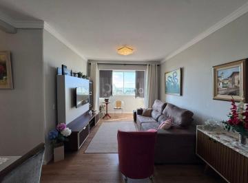 Sala de tv · Apartamento à venda com vista para o mar