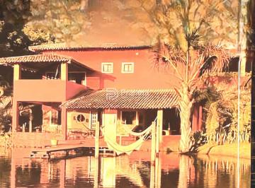 Casa · 413m² · 4 Quartos · 5 Vagas · Casa Exclusiva à Beira da Lagoa na Reserva Aruá – 2.360m² de Natureza e Conforto