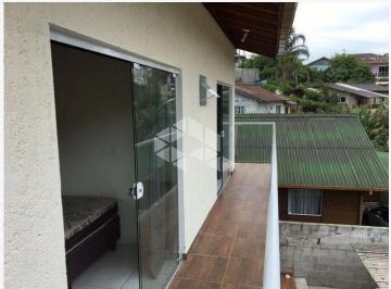 701915_ilCTfH41n398_7019156867da91355eb.jpg · Oportunidade para Investidor: Casa com Renda Garantida no Rio Tavares | 2 Suítes - Pagamento à Vista